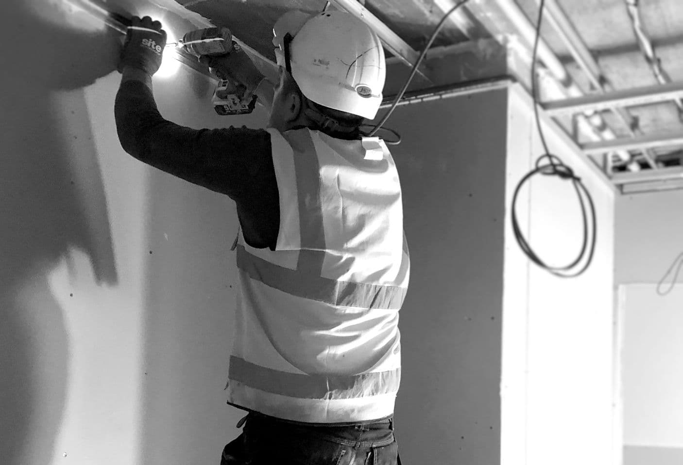 man fixing ceiling
